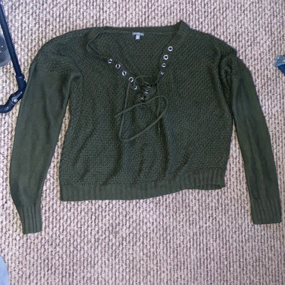 Long sleeve fuzzy shirt with v shaped string you can style however.